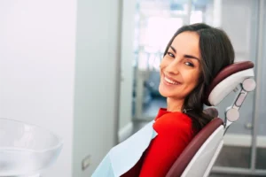 Smiling patient at our cosmetic dentistry in Tulsa, OK, after her dental treatment.